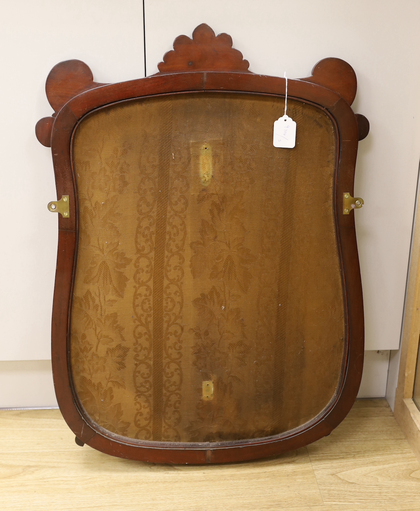 A Victorian petite point embroidered panel, in shield shaped mahogany frame (ex pole screen), 80cm high, 56cm wide